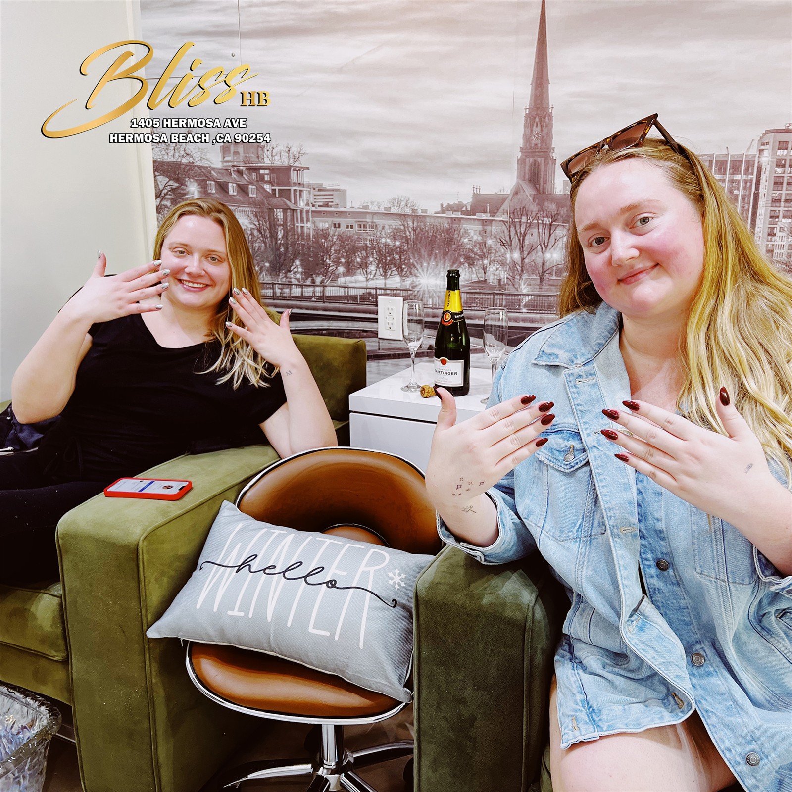 Guests showing their manicures in a photograph published by Bliss Nail Lounge