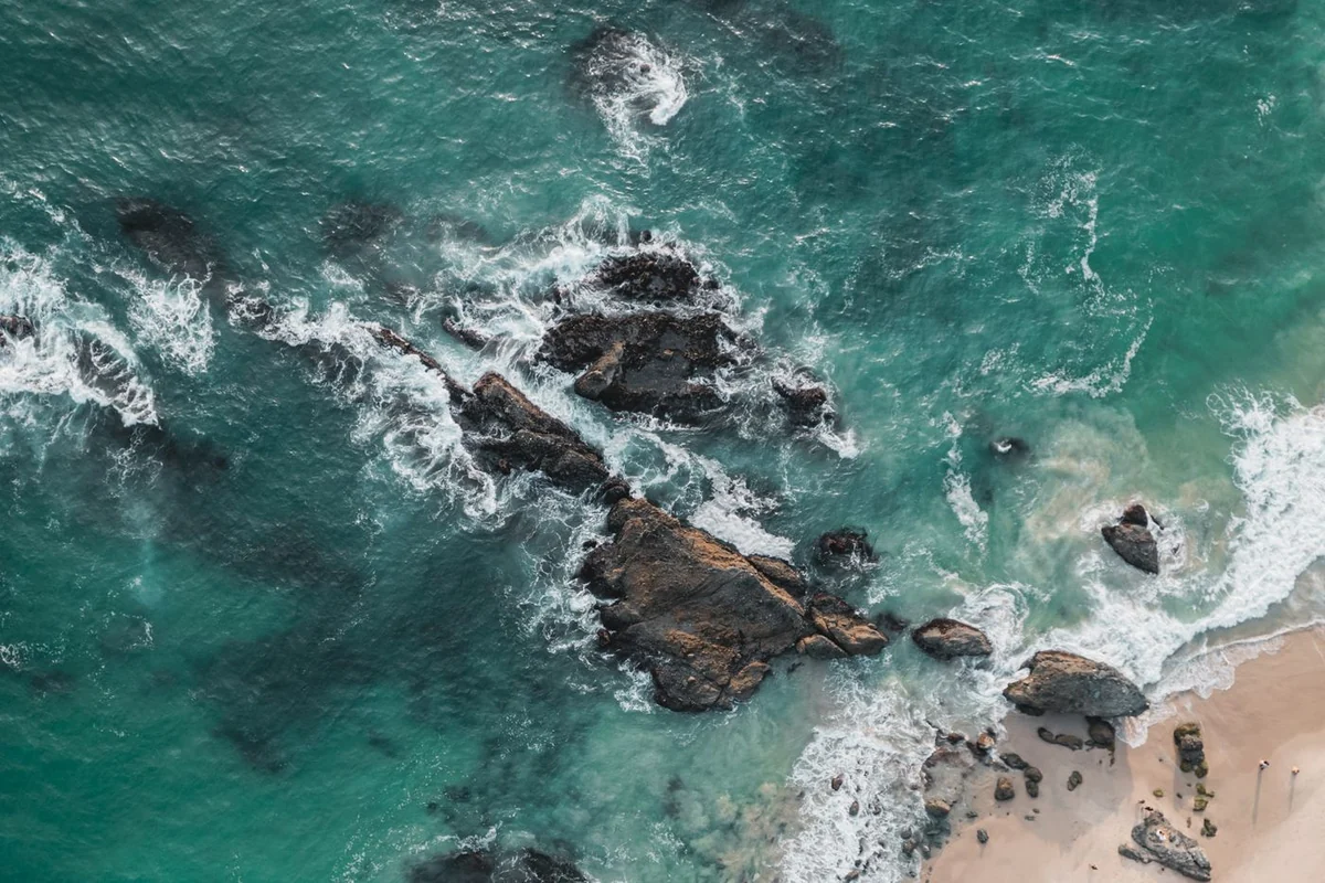 Turquoise waves meet a rocky stretch of Laguna Beach.