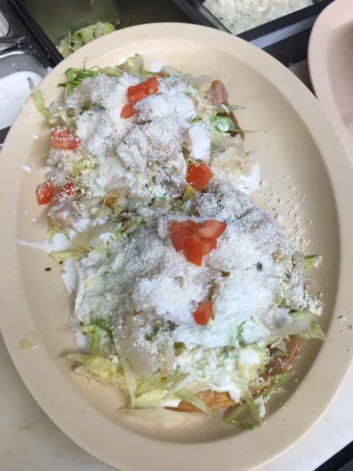 Licha’s Restaurant · lettuce-and-cheese-topped dish