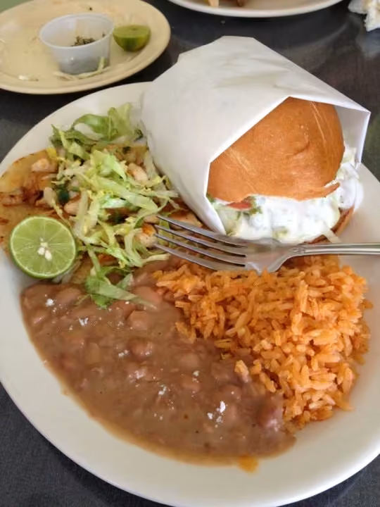 Licha’s Restaurant · plated meal with rice and beans