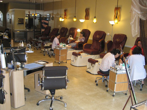 Pedicure chairs and manicure stations inside Lovely Nails & Day Spa