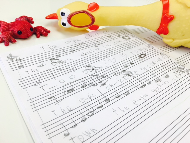 A handwritten composition with playful rhythm props