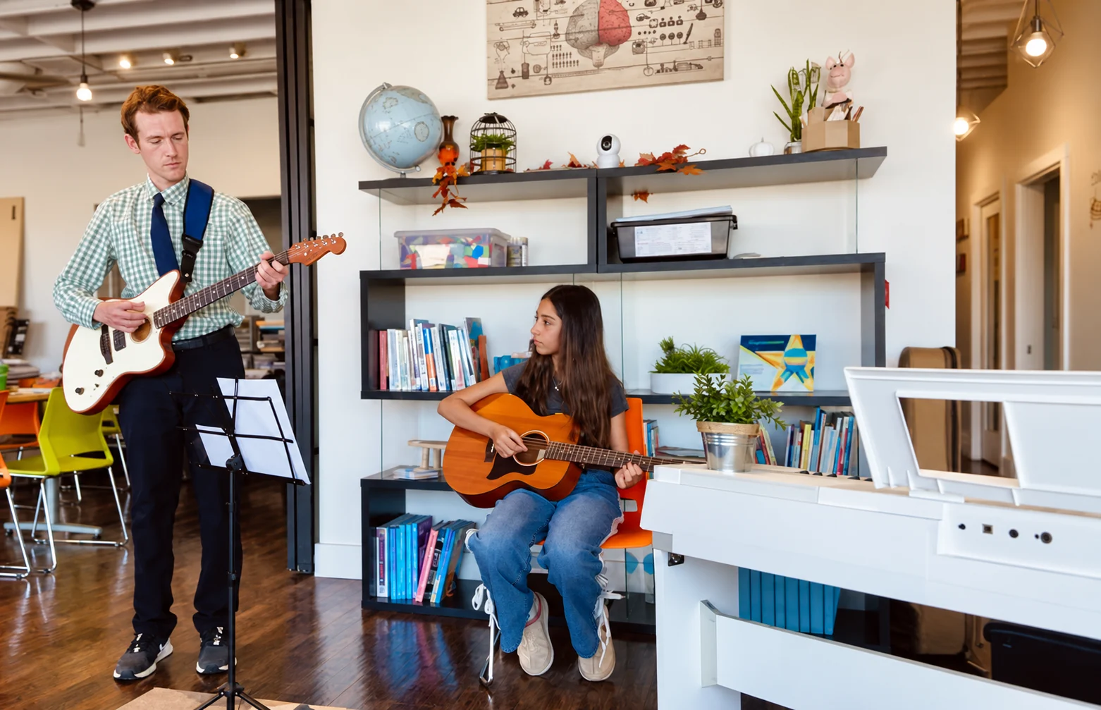 A guitar lesson in Melody & Chord’s creative learning space