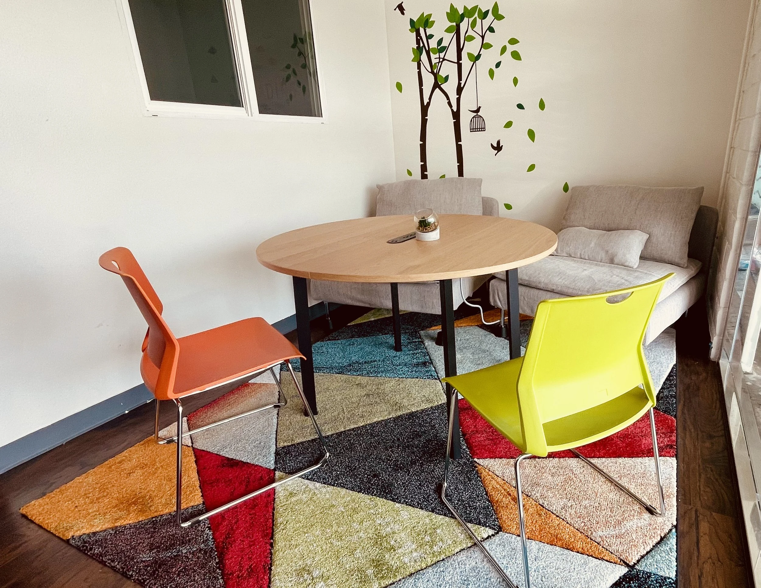 A small meeting space with a round table.