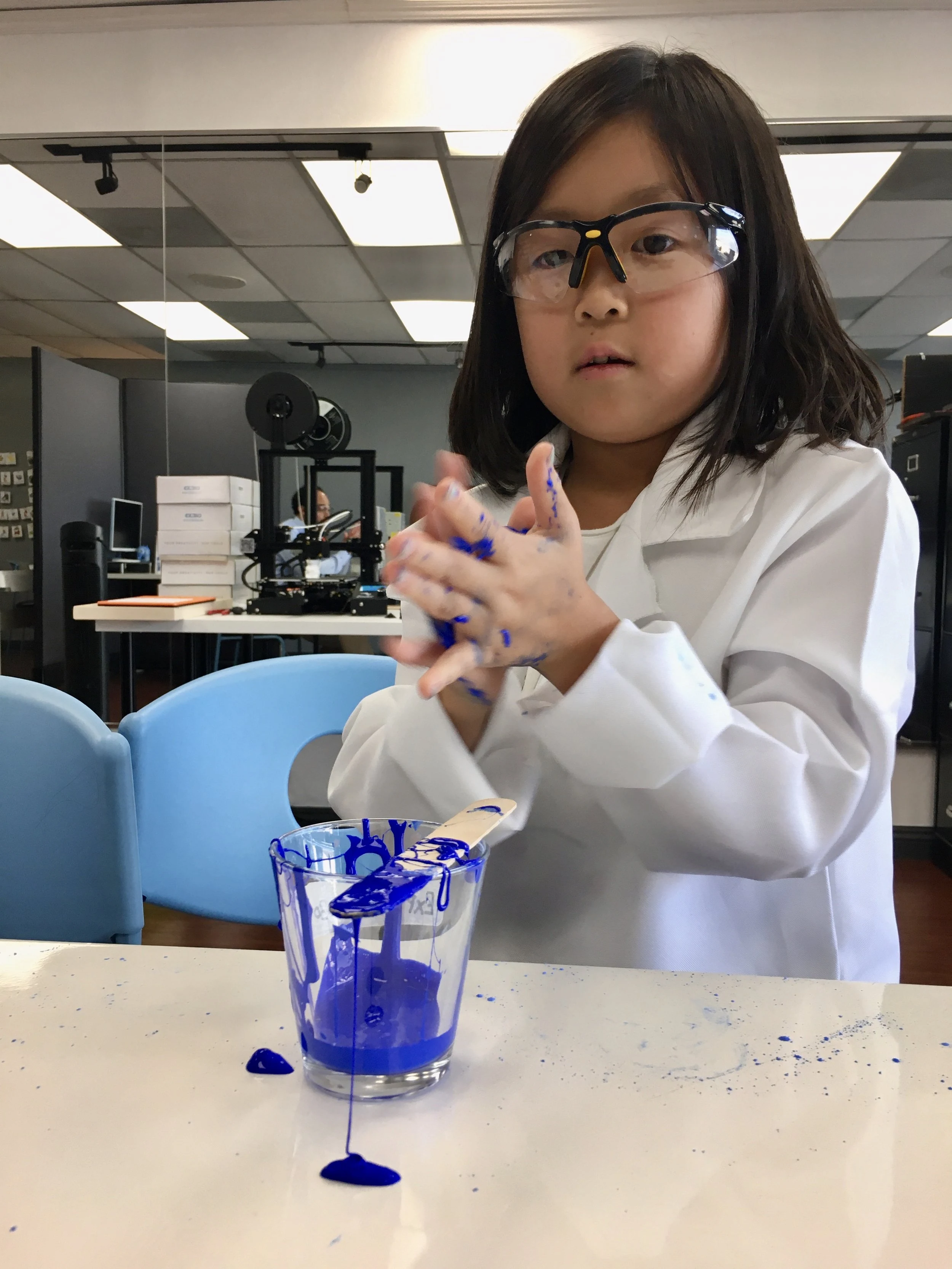 A student exploring a hands-on mechanism.