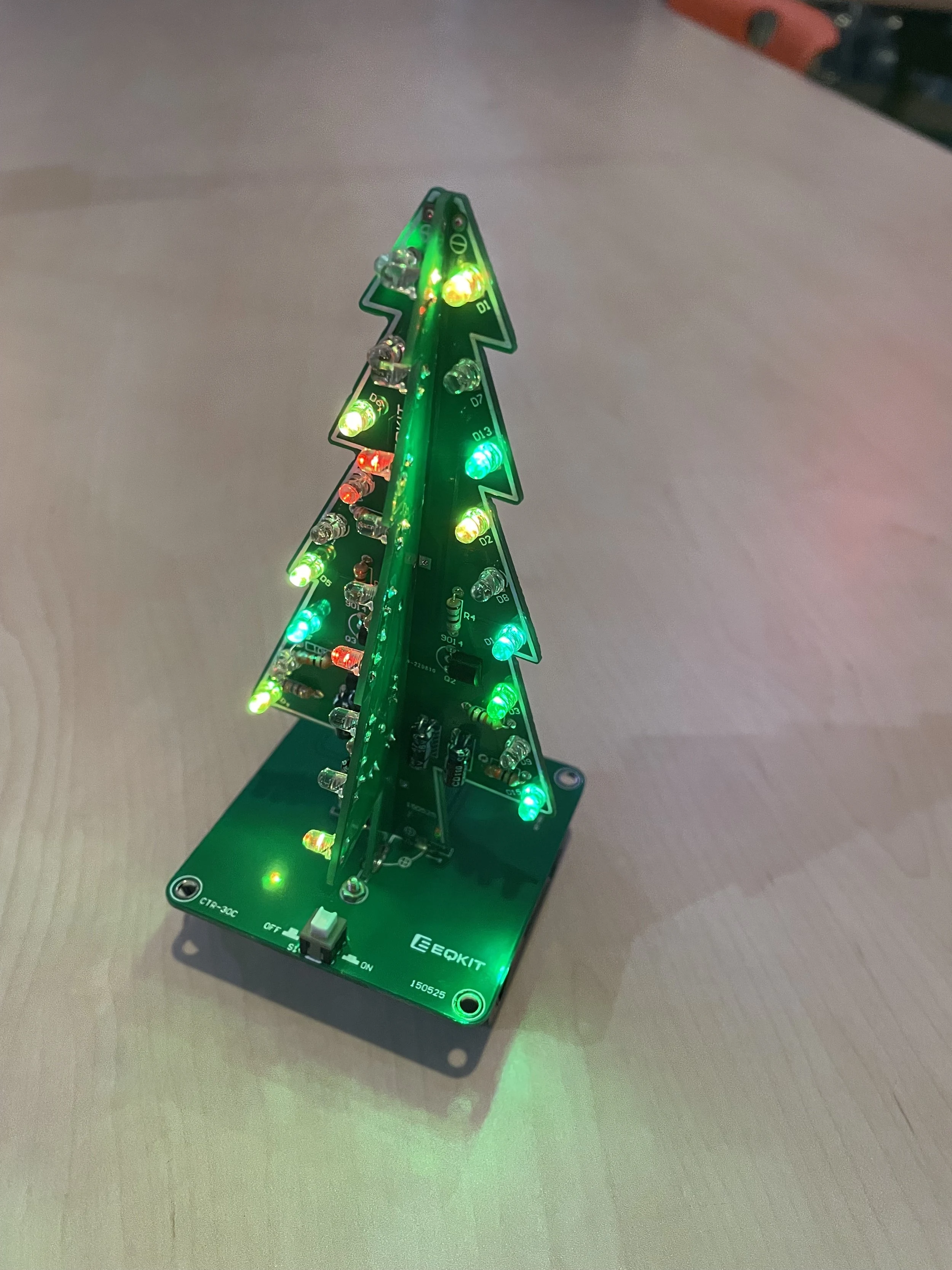 An illuminated tree-shaped circuit board.