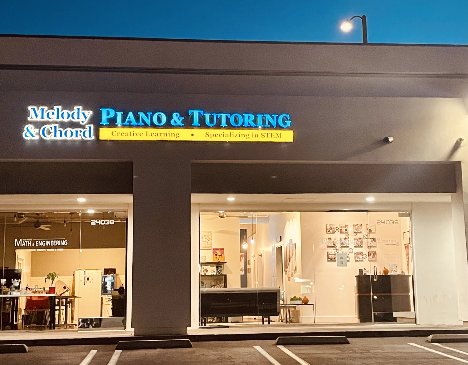 The school storefront at night.