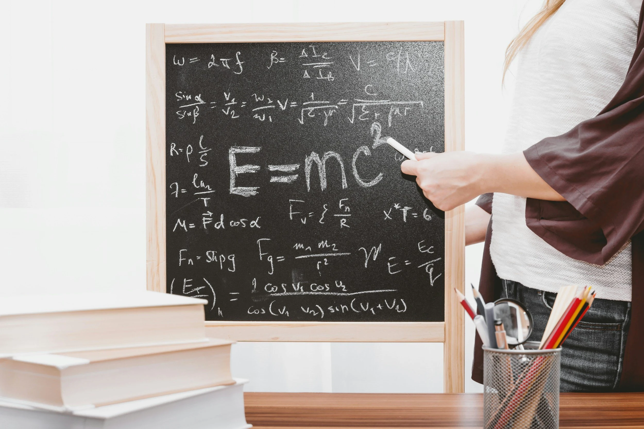 A classroom chalkboard with mathematical expressions.
