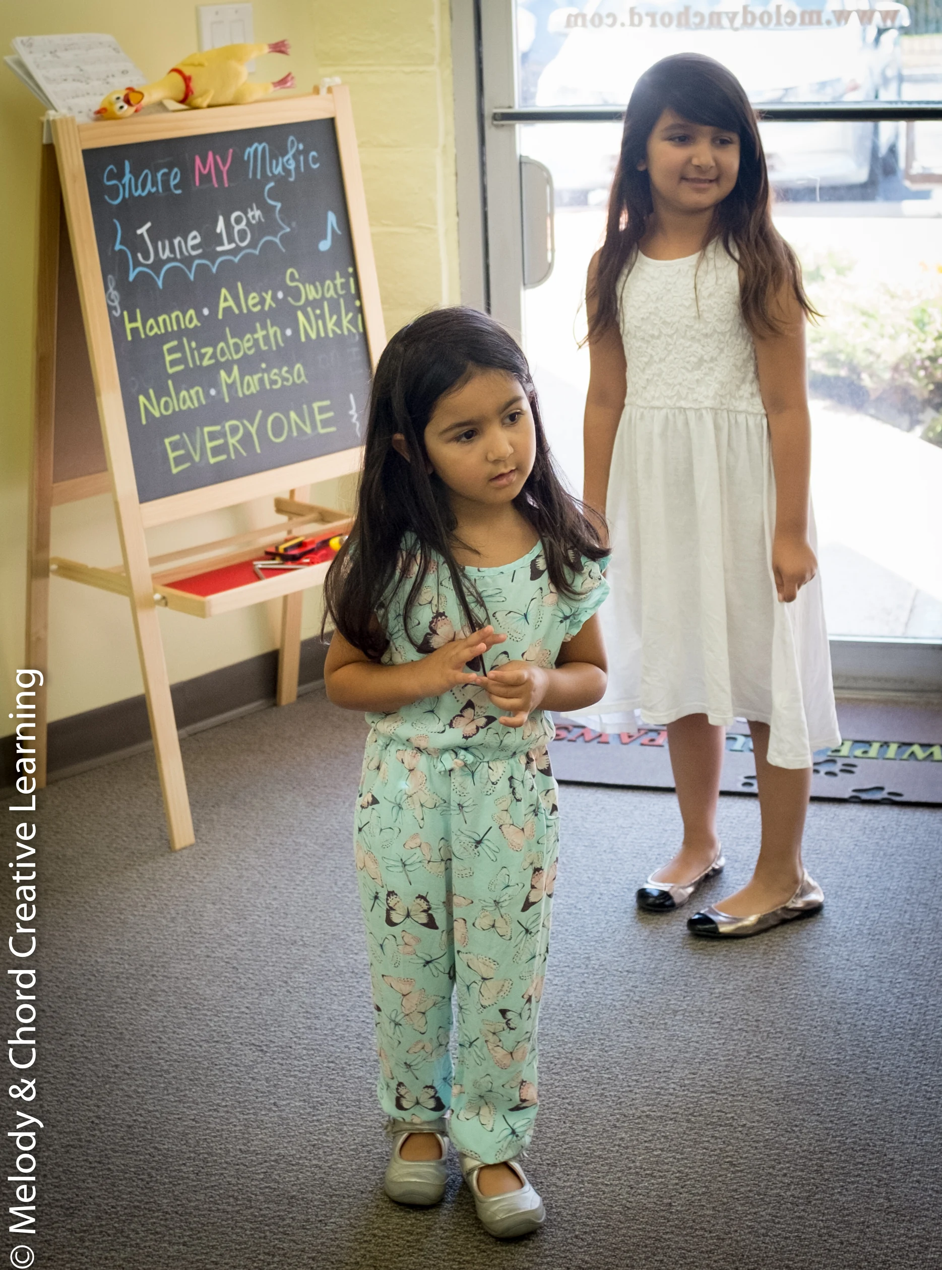 Two students at a school music event.