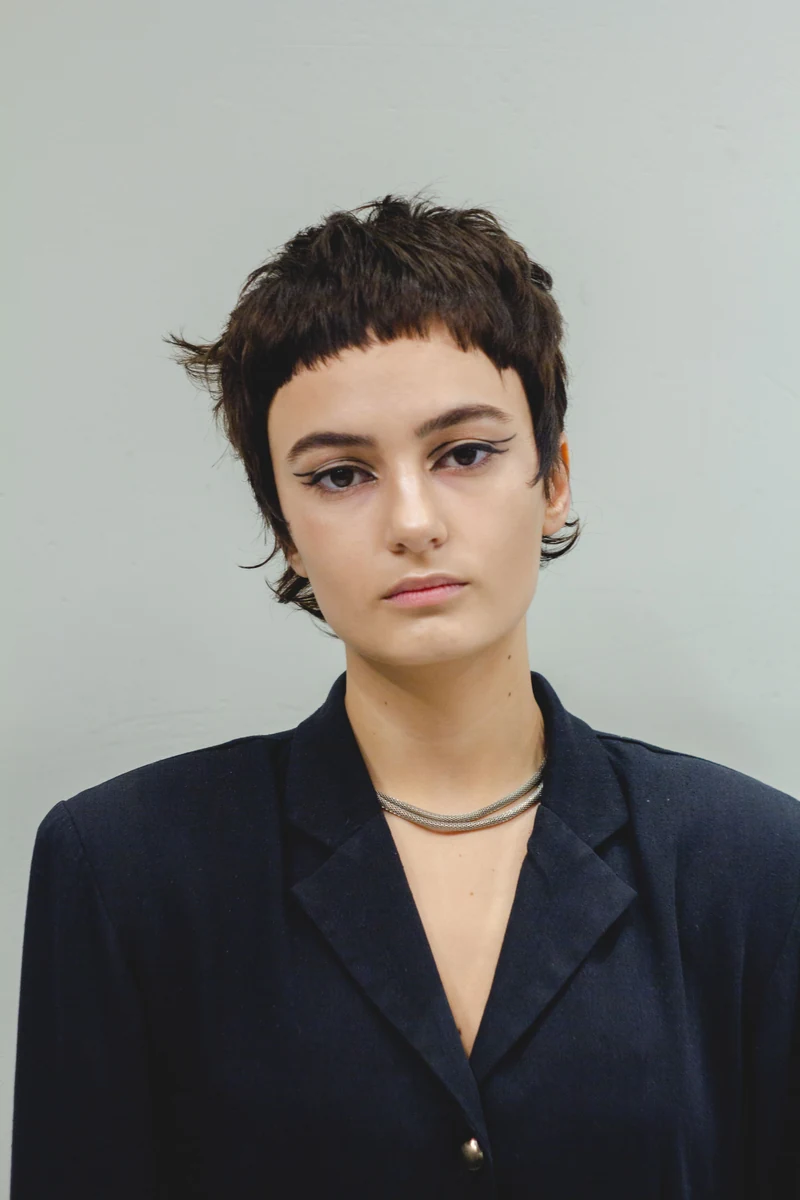 Fashion portrait with a short hair silhouette and dark blazer
