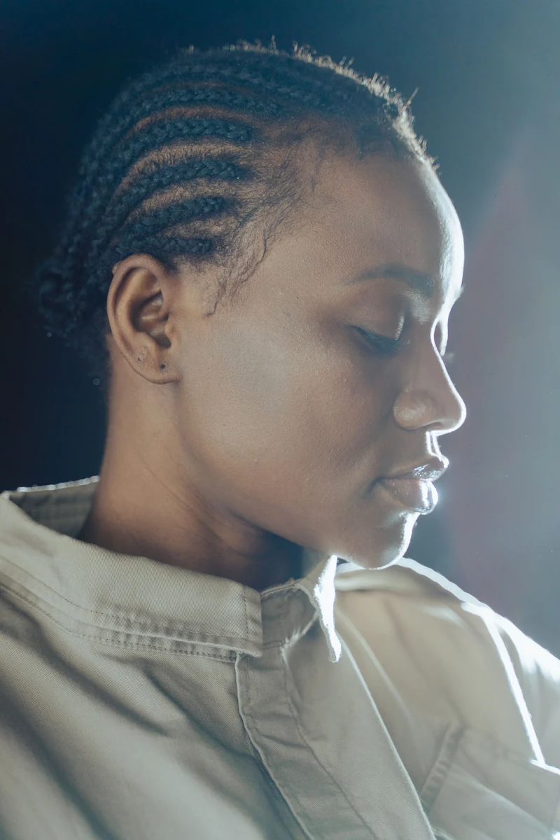 Profile portrait with braids swept away from the face