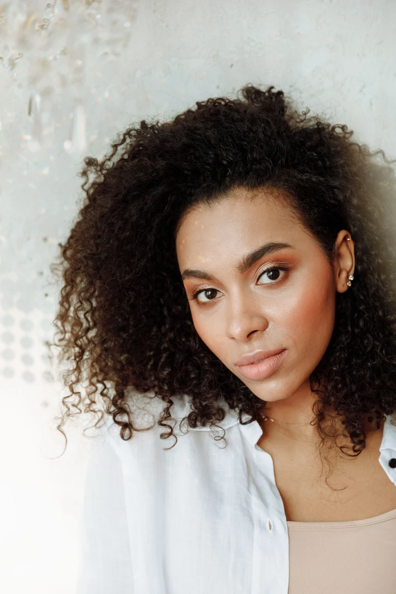 Close fashion portrait with natural curls