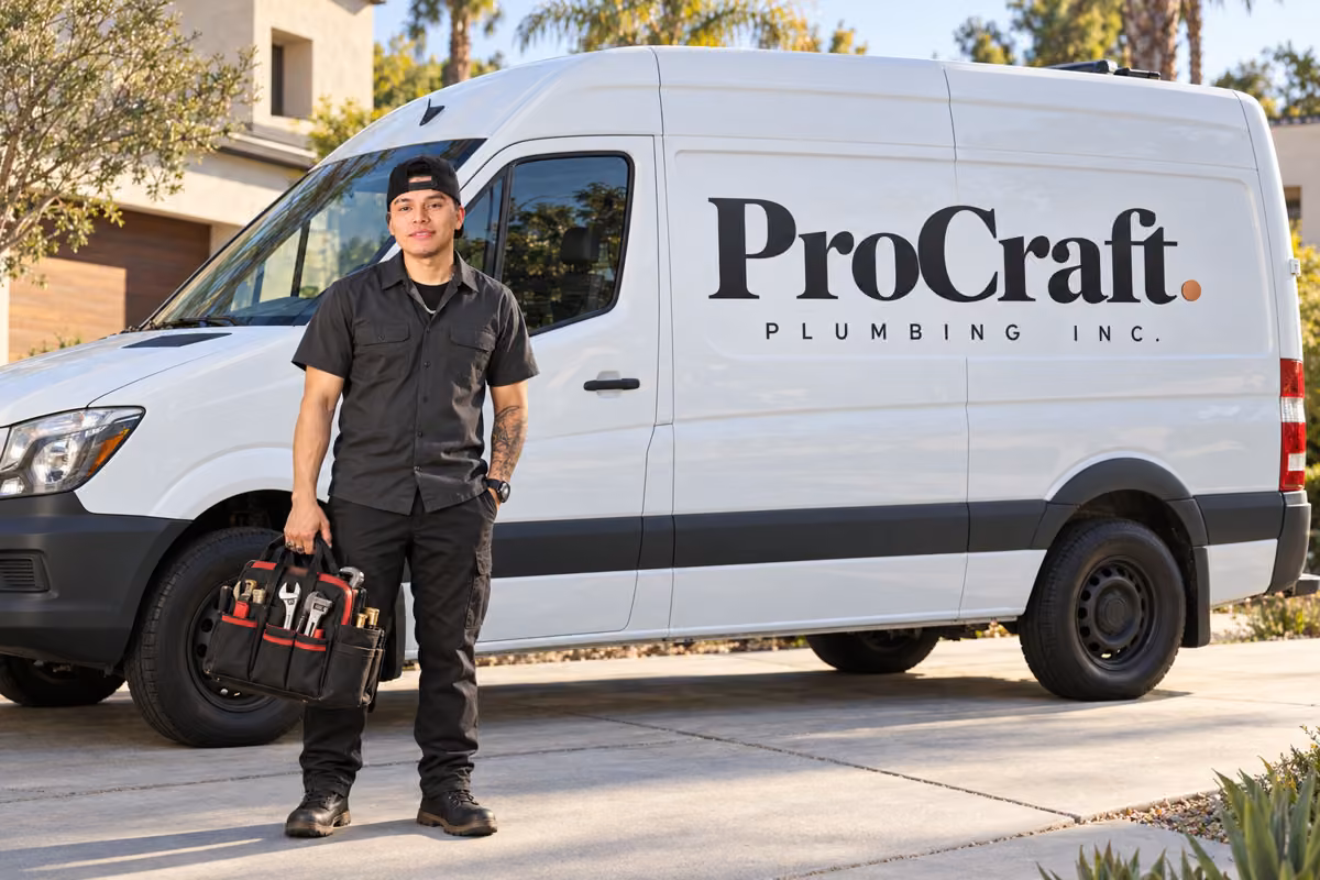 Jonathan Lopez beside a white van with the ProCraft Plumbing wordmark