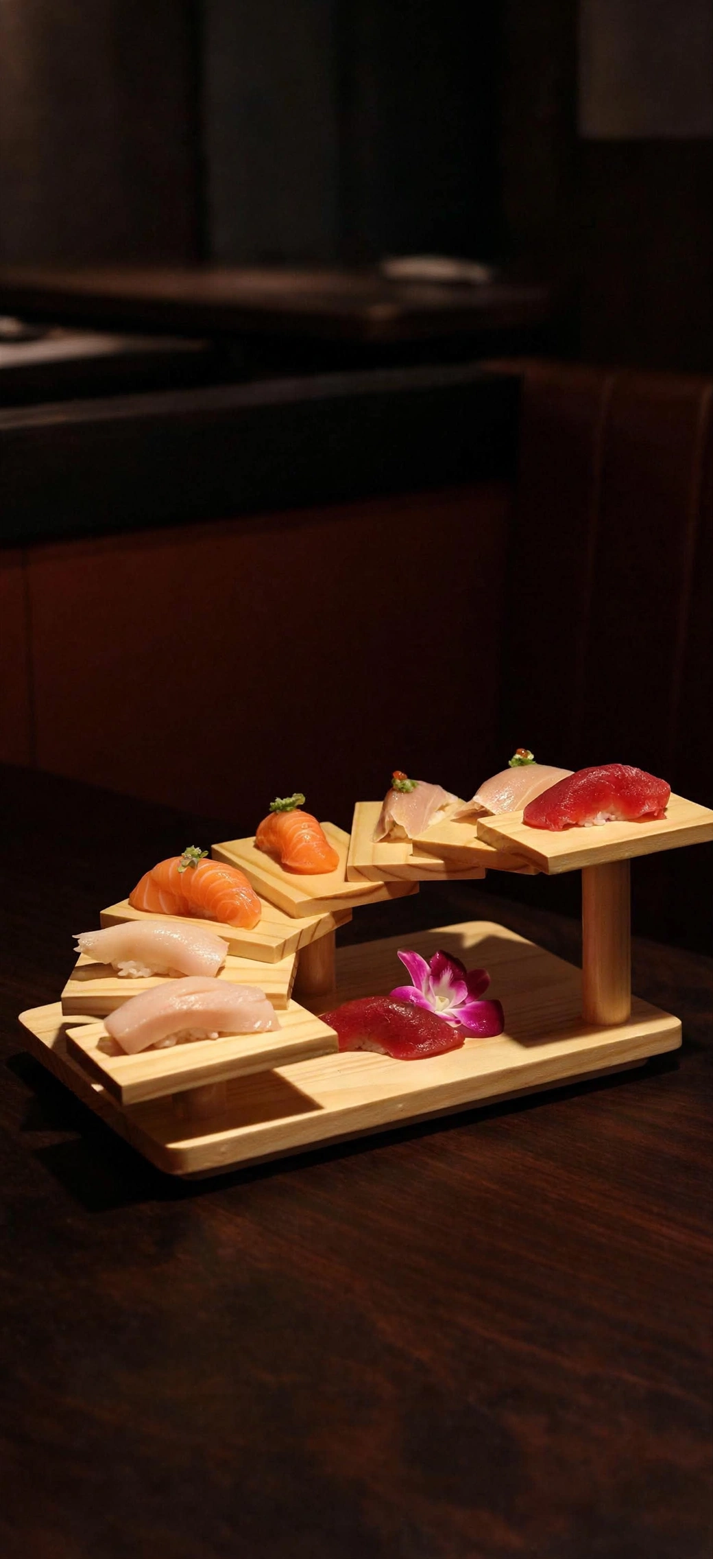 Nigiri arranged on a curved wooden display