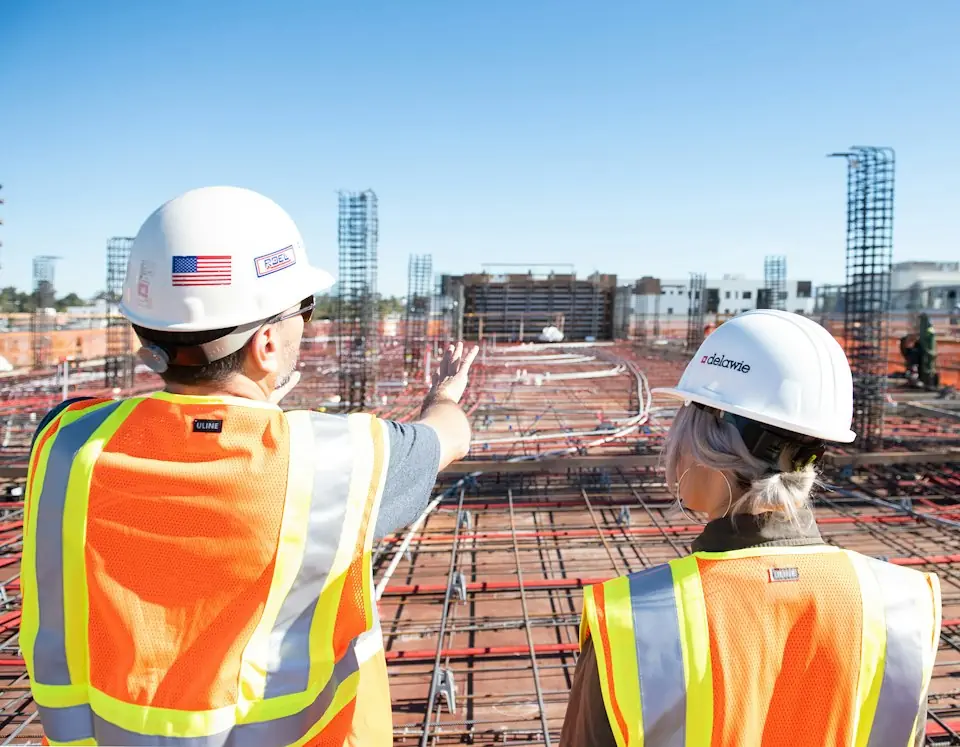 Brasstech, Inc. · Two construction professionals reviewing a building site — illustrative stock photograph 6