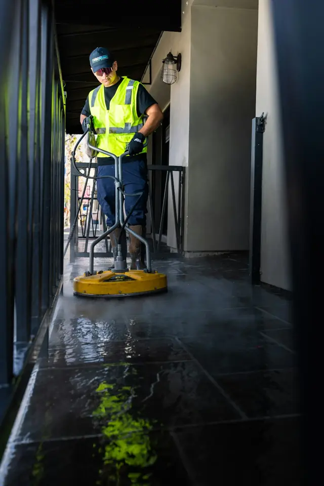 Boardwalk Cleaners · Cleaner working with floor-cleaning equipment — illustrative stock photograph 8