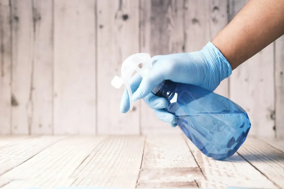 Boardwalk Cleaners · Gloved hands cleaning a wooden surface — illustrative stock photograph 4