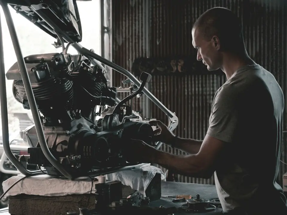 Albertos Polishing · Mechanic working at an engine on a workshop stand — illustrative stock photograph 5