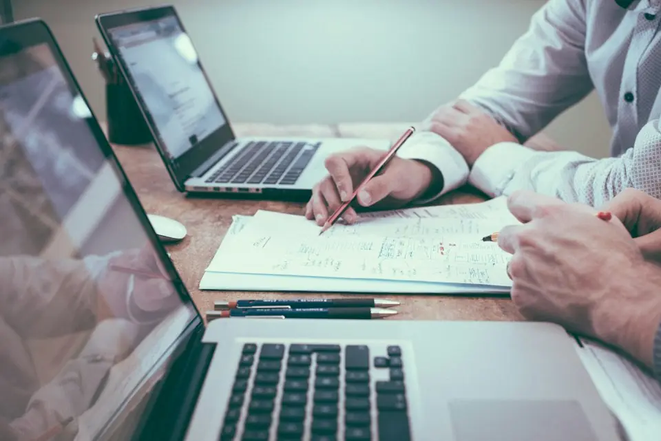 Central Rv Storage · People reviewing documents and laptops at a table — illustrative stock photograph 6