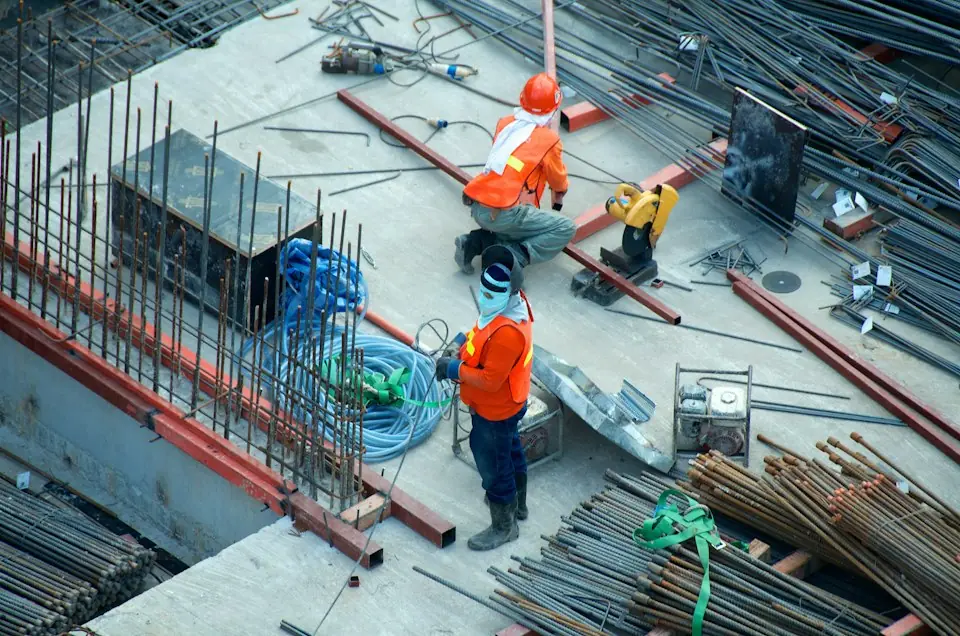 Brasstech, Inc. · Workers coordinating reinforcement at a construction site — illustrative stock photograph 5
