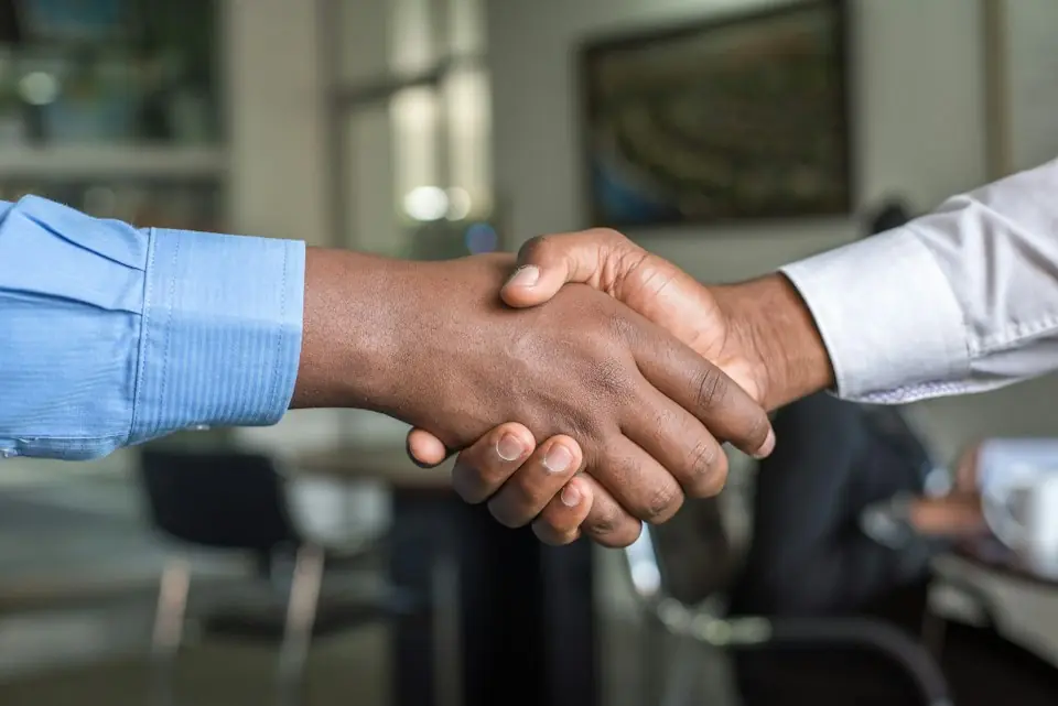 Central Rv Storage · Two people shaking hands in a business setting — illustrative stock photograph 4