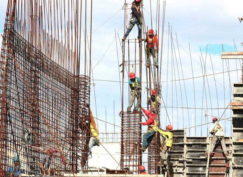 Brasstech, Inc. · Construction workers assembling reinforced building structure — illustrative stock photograph 4