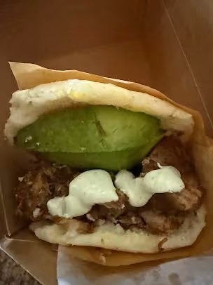Venezuelan Bakery & Cafe · an avocado-topped arepa
